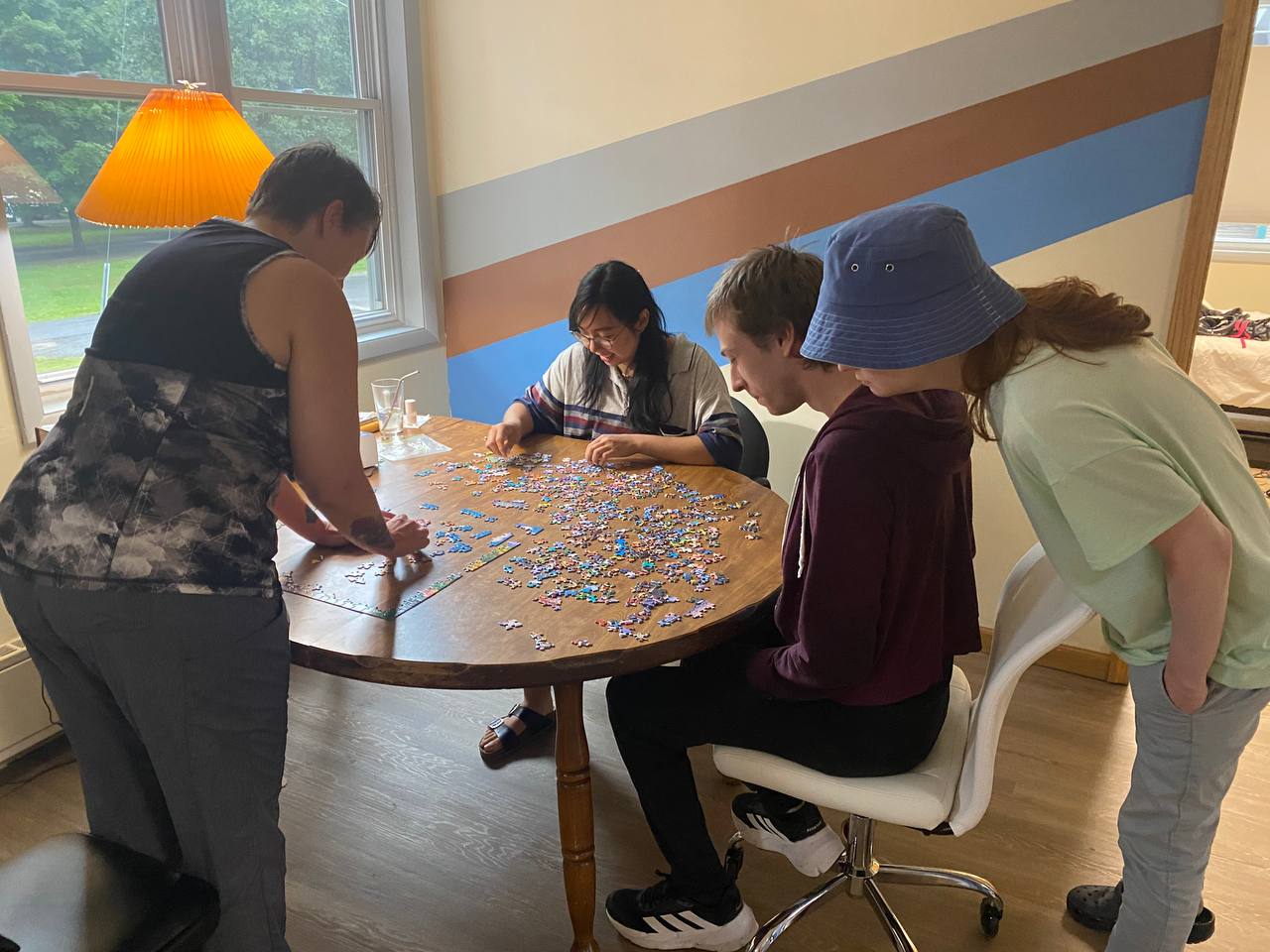 Group working on a tabletop puzzle