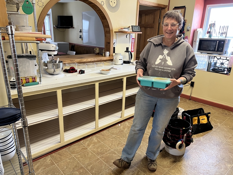 Stella working on renewing the bottom cabinet shelving