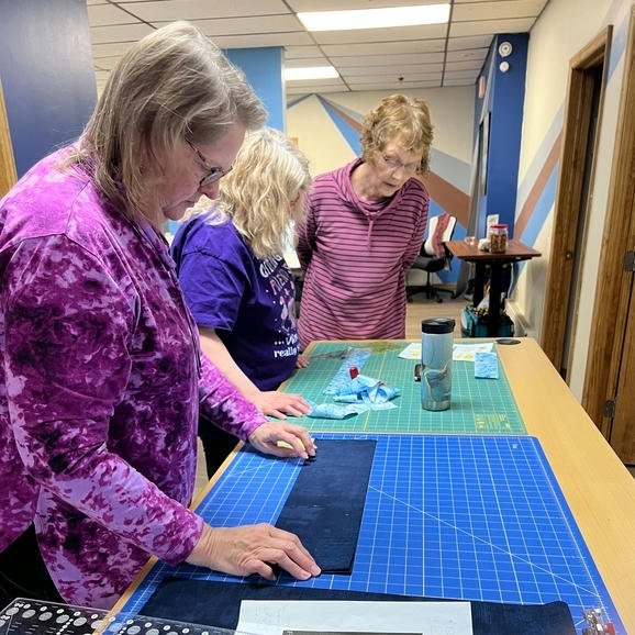 cutting fabric at the large cutting station