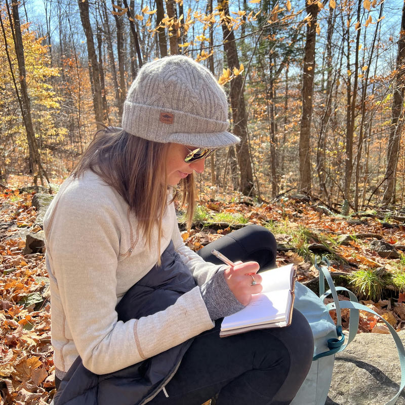 Megan doing a quick sketch while hiking in Adirondack Park