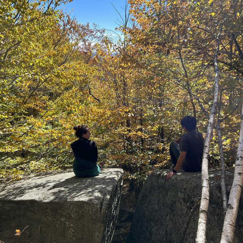 Relaxing on some boulders during an autumn hike