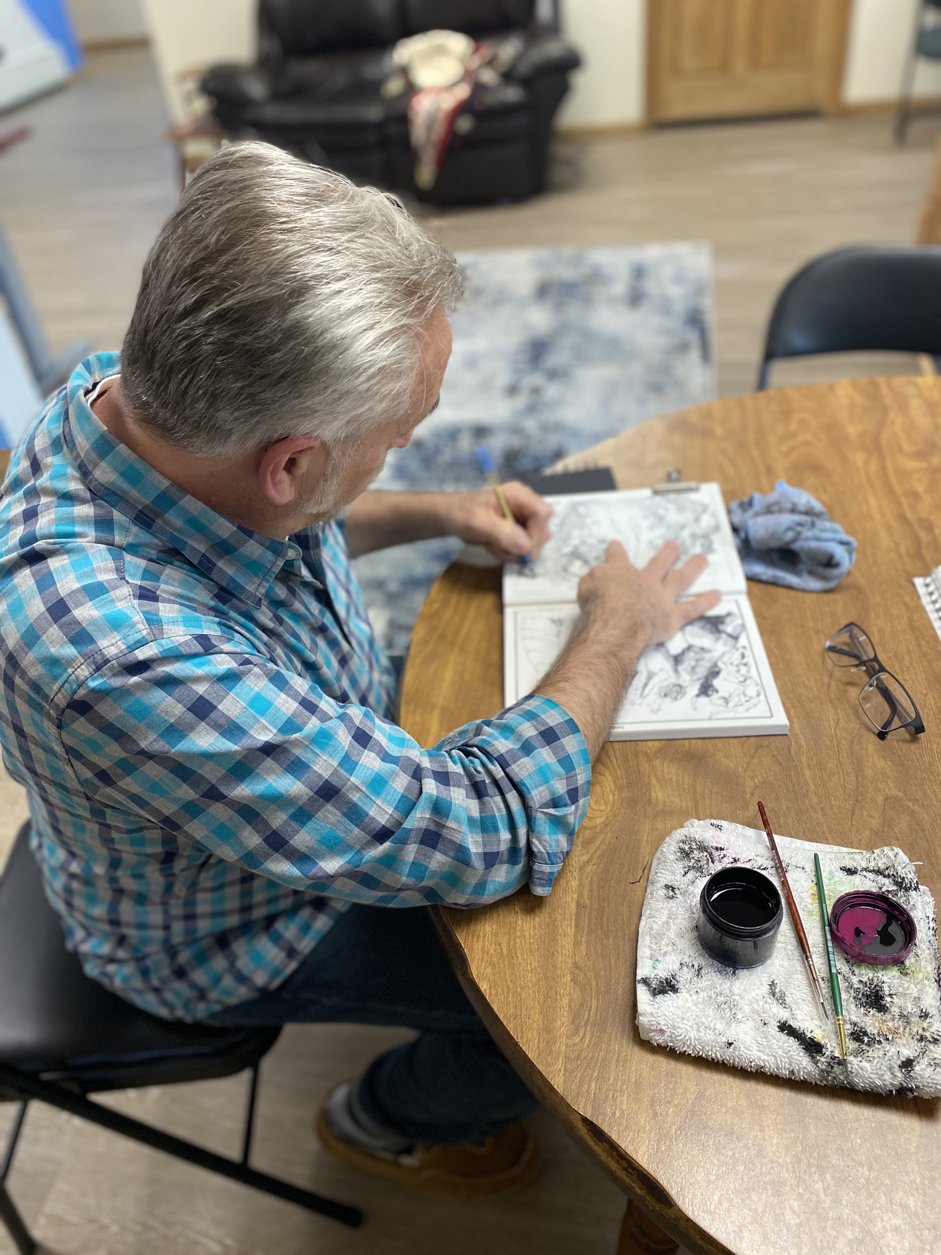 George working on his Inktober illustrations